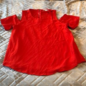 Red blouse with shoulder holes